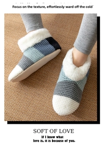 Close-up of cozy striped thermal socks with plush faux fur lining for indoor winter warmth