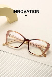 Detail of cat-eye glasses frame with brown gradient finish and rose gold glitter decor