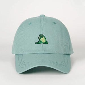 Close-up of cute yoga frog embroidery on light green cotton adjustable baseball cap