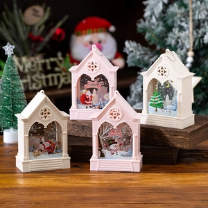 Pink and white LED Christmas lantern with Santa scene for festive desktop decoration