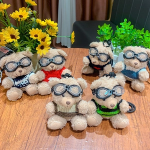 Cute teddy bears with pilot goggles in colorful sweaters on a rustic wooden table