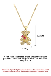 Detail of teddy bear pendant with full zircon inlay and red heart stone on gold chain
