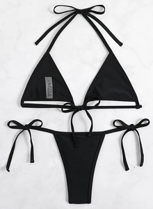 Detailed flat lay of a black triangle bikini set with side-tie bottoms and S-size care label