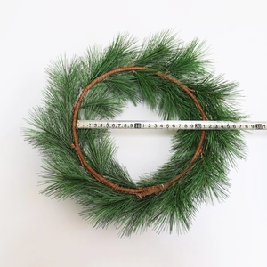 Green PVC artificial pine needle wreath with 30cm measurement on white background