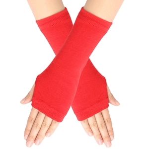 Detailed close-up of red knitted fingerless gloves showing fine fabric texture and cross pose