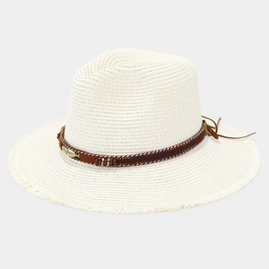 Straw sun hat with ethnic feather band and frayed edges for beach vacation