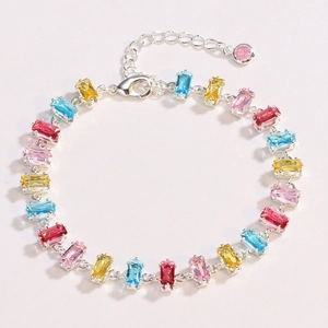 Macro shot of colorful rectangular crystals on silver chain with lobster clasp detail