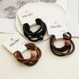 Set of 4 minimalist elastic hair bands in black and coffee brown with decorative beads