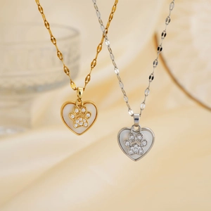 Minimalist heart-shaped pendant necklace with cubic zirconia paw print in gold and silver