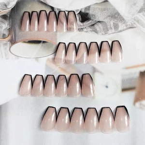 Nude pink gradient ballet fake nails with elegant black French tips and coffin shape