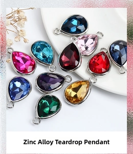 Detailed macro view of 7x10mm teardrop alloy pendants in various vibrant crystal colors