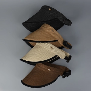 Detail of four foldable sun visors with frayed edges and golden leaf metal accents