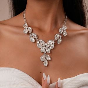Detailed macro view of silver statement necklace with marquise leaf crystal patterns