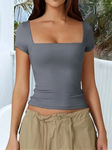 Detail shot of a slim-fit grey square neck T-shirt for women in an outdoor setting