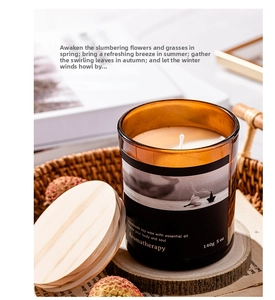 Macro shot of 140g soy wax candle in amber glass jar with wooden lid on woven basket
