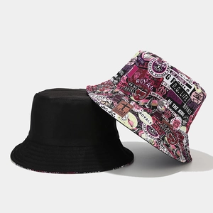 Reversible graffiti bucket hat set with one solid black and one purple printed canvas sun hat