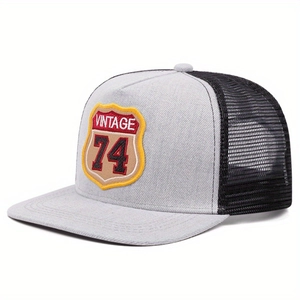 Vintage style two-tone mesh trucker hat in grey and black with VINTAGE 74 shield patch