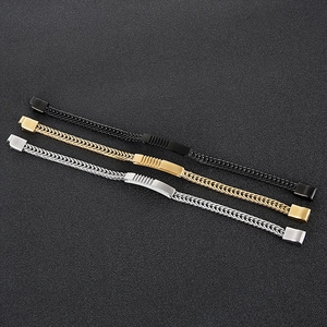 Detailed close-up of woven stainless steel bracelets in gold, silver, and black finishes
