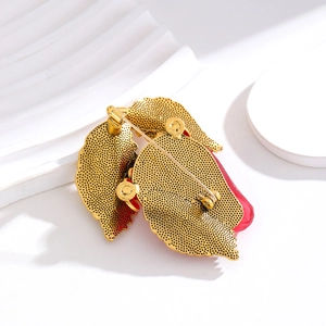 Retro resin strawberry brooch featuring a gold-toned metal back with secure safety pin clasp