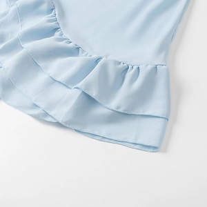 Detail of light blue chiffon layered ruffles with delicate hem stitching on women blouse