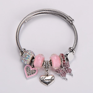 Detail showing pink butterfly charm and engraved Lovely heart on silver twisted wire bracelet
