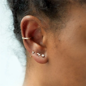 Close-up of S925 sterling silver marquise opal and gold zircon stud earrings set