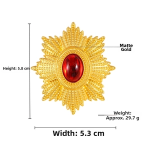 Detailed view of matte gold medal brooch with red gemstone and precise dimensions