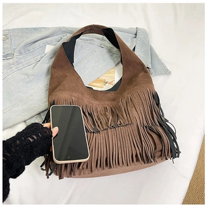 Detailed size comparison of a brown suede tassel shoulder bag with a smartphone
