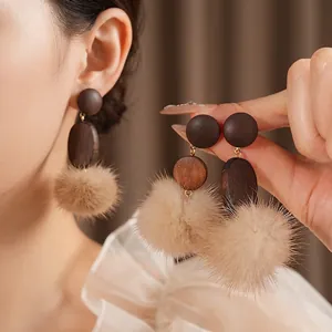 Vintage round oval wood earrings with light brown pom-pom and silver needles for women