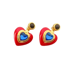 Vintage style gold heart earrings with red enamel and blue crystal in a nested design