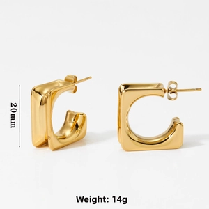 Detail shot of golden C-shaped hoop earrings with dimensions 20mm and 14g weight