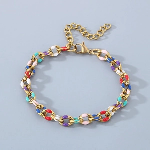 Detail of 18K gold Cuban link bracelet with colorful enamel drip oil charms and lobster clasp