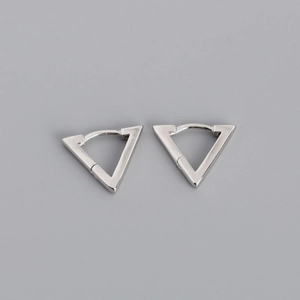 Macro detail of silver triangular hoop earrings with a polished metallic finish and sleek edges