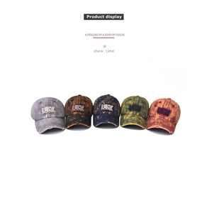 Detailed display of five colors of vintage washed cotton baseball caps with LUCK embroidery