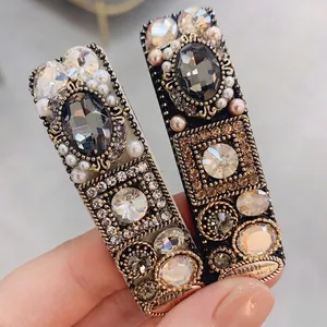 Baroque style gold hair clips with crystals and pearls for a vintage luxury look