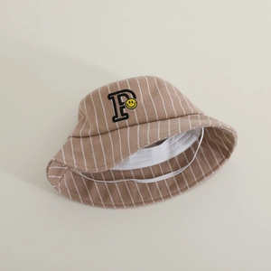Detailed view of khaki striped bucket hat with smiley letter P and elastic wind strap