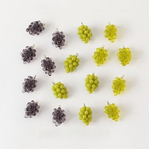Detailed view of colorful resin grape charms with metal loops for DIY jewelry making