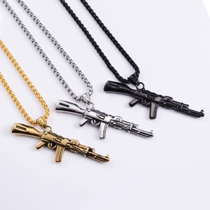 Detailed view of AK47 rifle pendant necklaces in gold, silver, and black stainless steel
