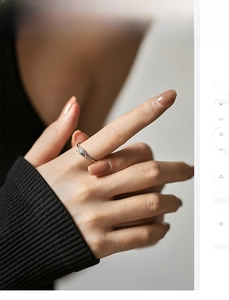 Close-up of S925 silver ring featuring rectangular clear and blue teardrop crystals
