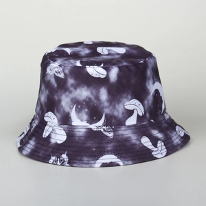 Detail of tie-dye bucket hat with mushroom, butterfly and crescent moon patterns