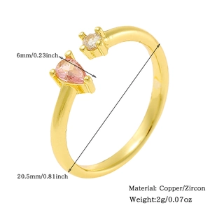 Detail view of 18K gold plated ring featuring pink pear and round white zircon stones