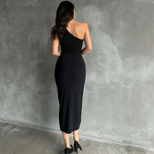 Close-up of the back and side silhouette of this black one-shoulder slim fit midi dress