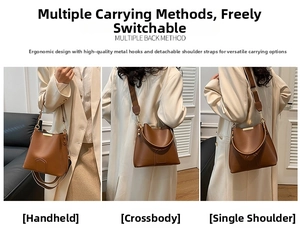 Brown leather bucket bag detail showing three versatile carrying ways with gold hardware