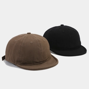 Cappellini retrò in cotone lavato a tesa corta in marrone e nero con trama twill