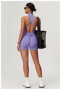 Rear view of purple yoga romper showing backless design and scrunch butt detailing