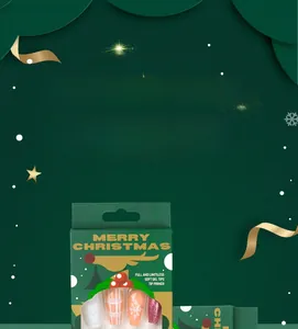 Detailed view of Christmas press-on nails set with orange snowflakes and glitter patterns