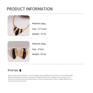 Detail showing vintage gold alloy snake chain with black enamel fan pendant and earrings
