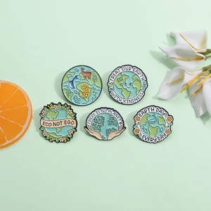 Set of 5 eco-themed enamel pins featuring earth and animals on a light green background