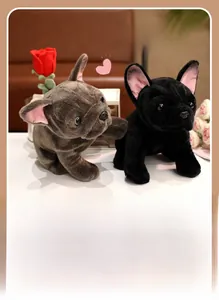 Detailed view of plush French Bulldog toys in black and grey on a cozy sofa