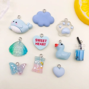 Assortment of cute pastel resin charms including whale, cloud, heart and cat paw for DIY crafts